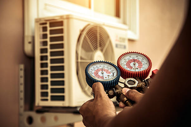 Professional Air Conditioning Service technician working in Flint, MI
